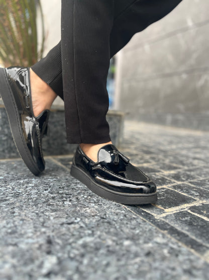 Mocassin pompon noir brillant