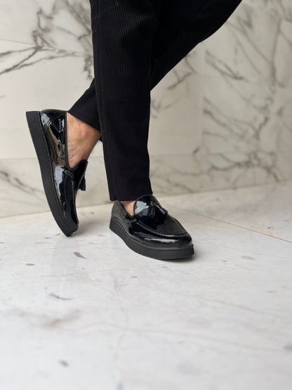 Mocassin pompon noir brillant