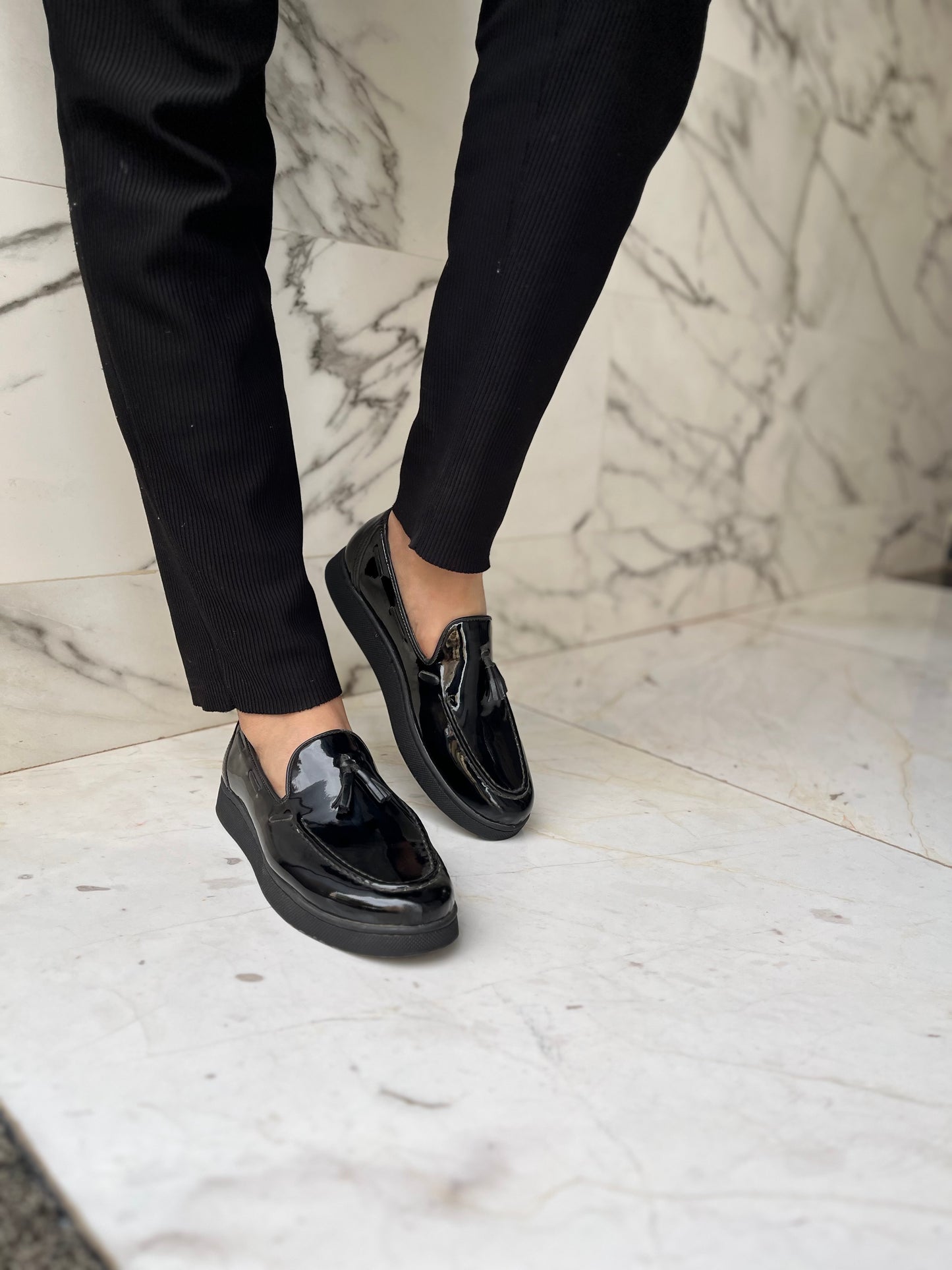 Mocassin pompon noir brillant