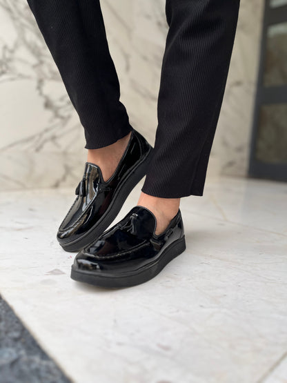 Mocassin pompon noir brillant